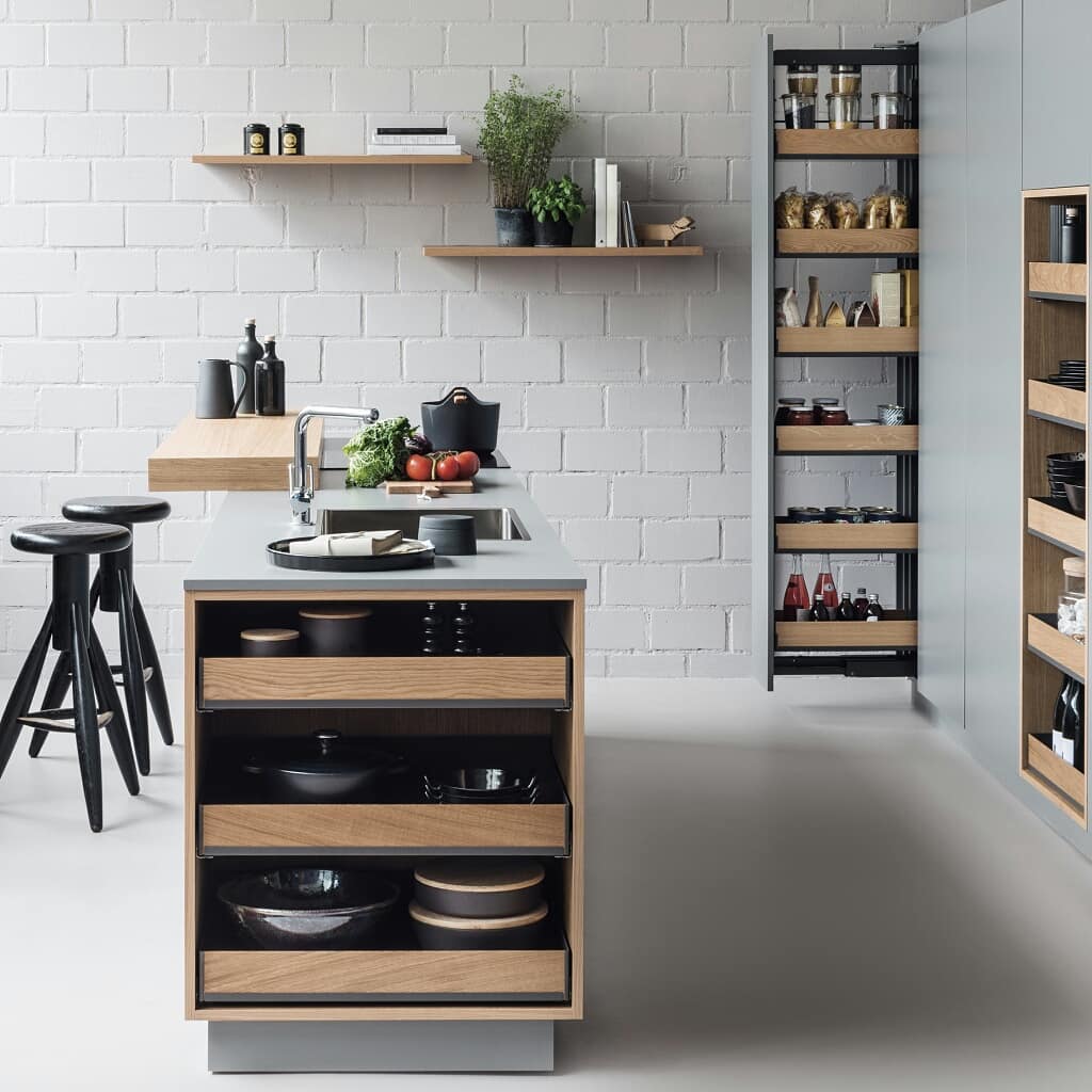 12. Sleek Black Pull-out Drawers with Geometric White Labels In a Glossy Finish