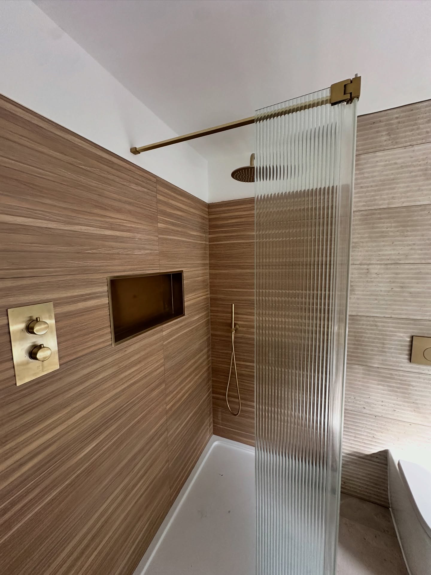 22. Cascading Waterfall Tiles with Frosted Glass Partition