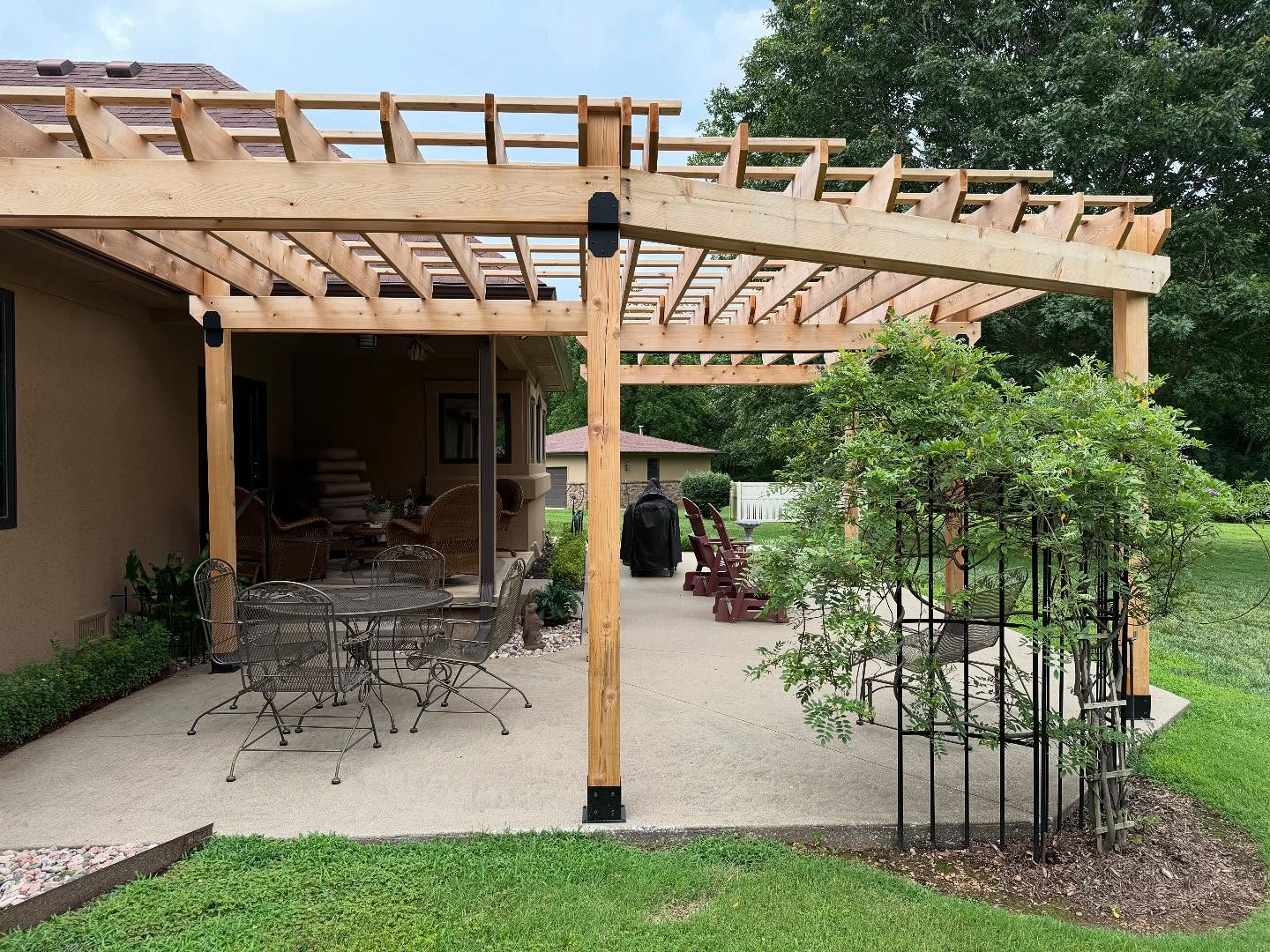 26. the Crimson Vine Canopy Over Rustic Wooden Bench