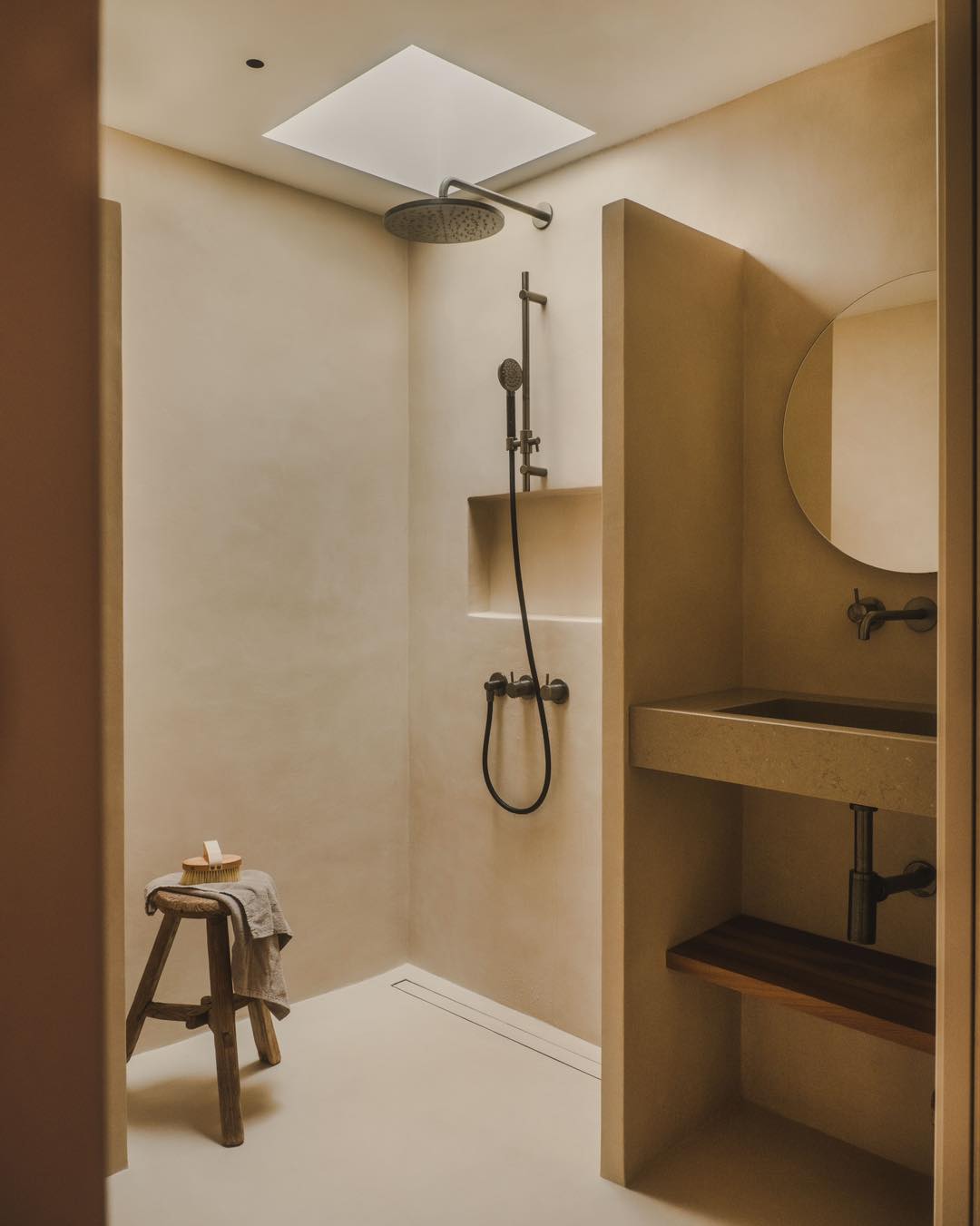 20. Cascading Waterfall Tiles and Sunlit Serenity In a Compact Walk-in Shower