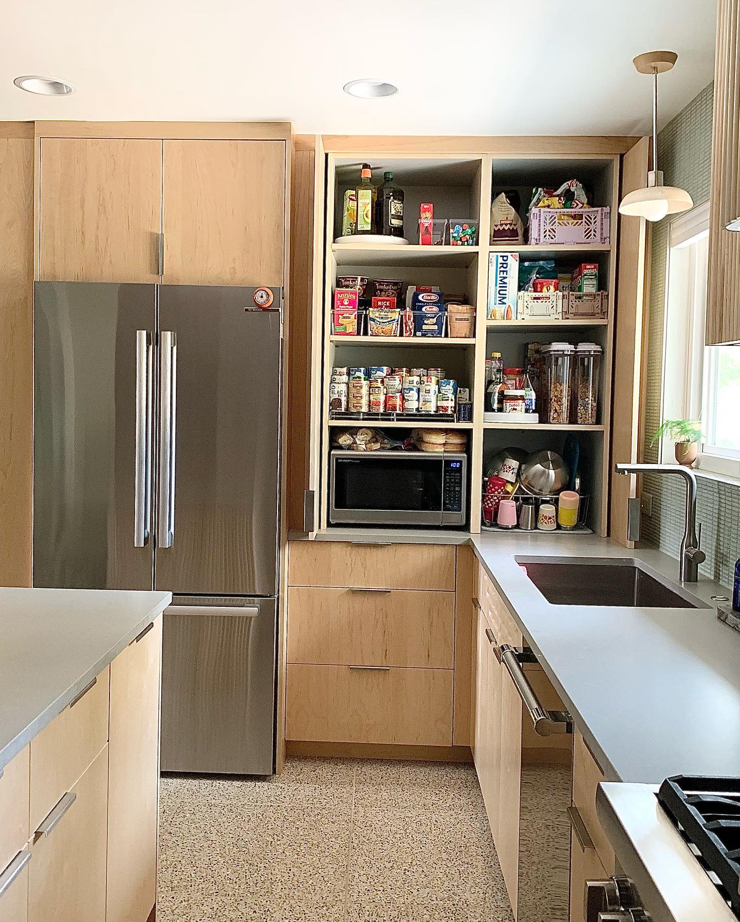 20. Vibrant Citrus Hues and Retro Geometric Patterns In a Mid-century Kitchen