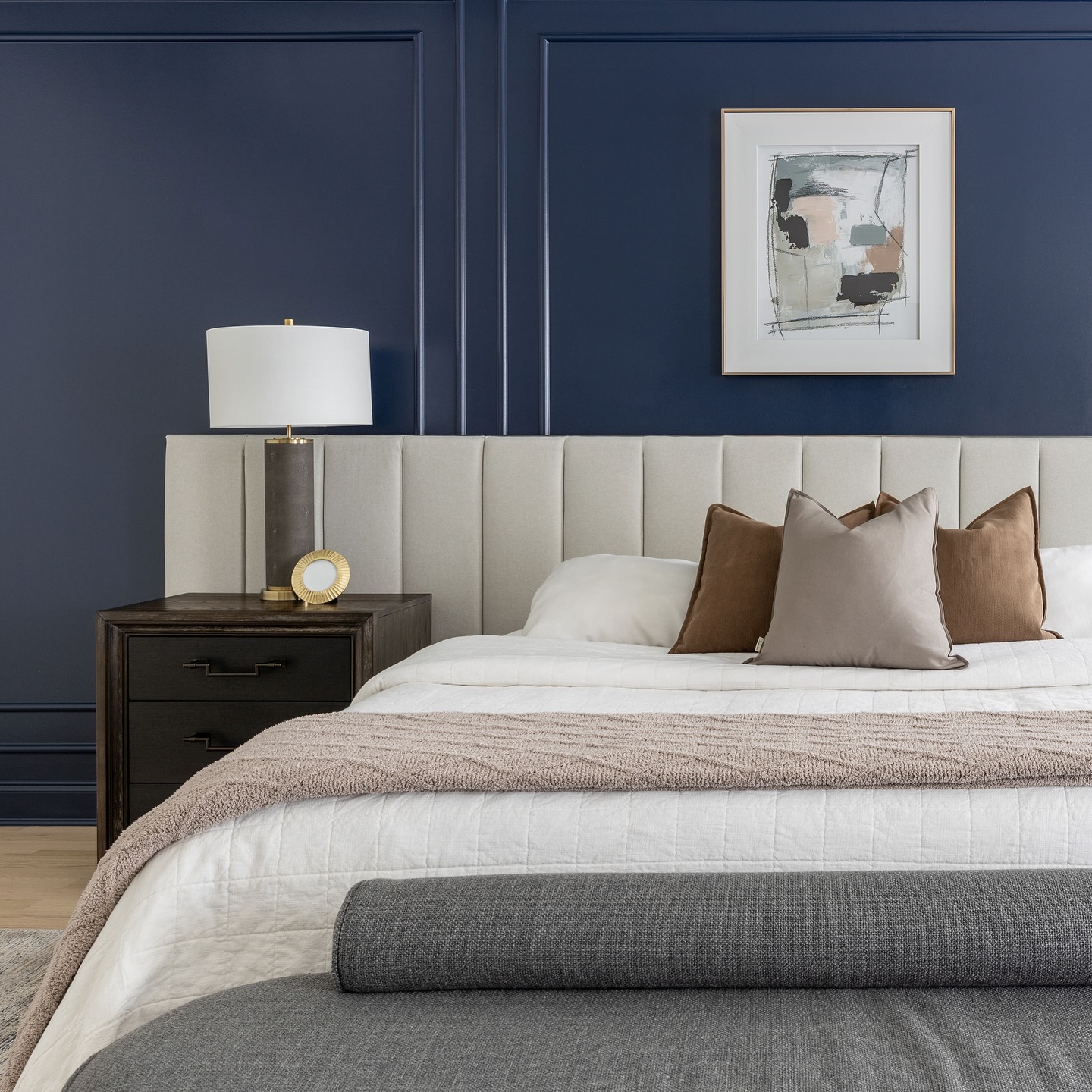 11. Vibrant Magenta Mural with Geometric Cutouts and a Suspended Orb Light