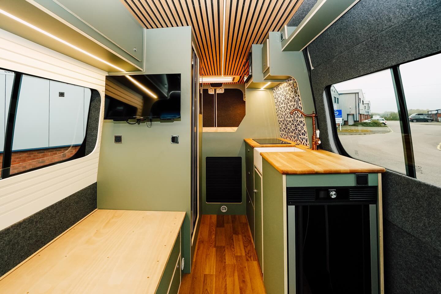 10. a Cozy Nook with a Teal Accent Wall and Geometric Cushions