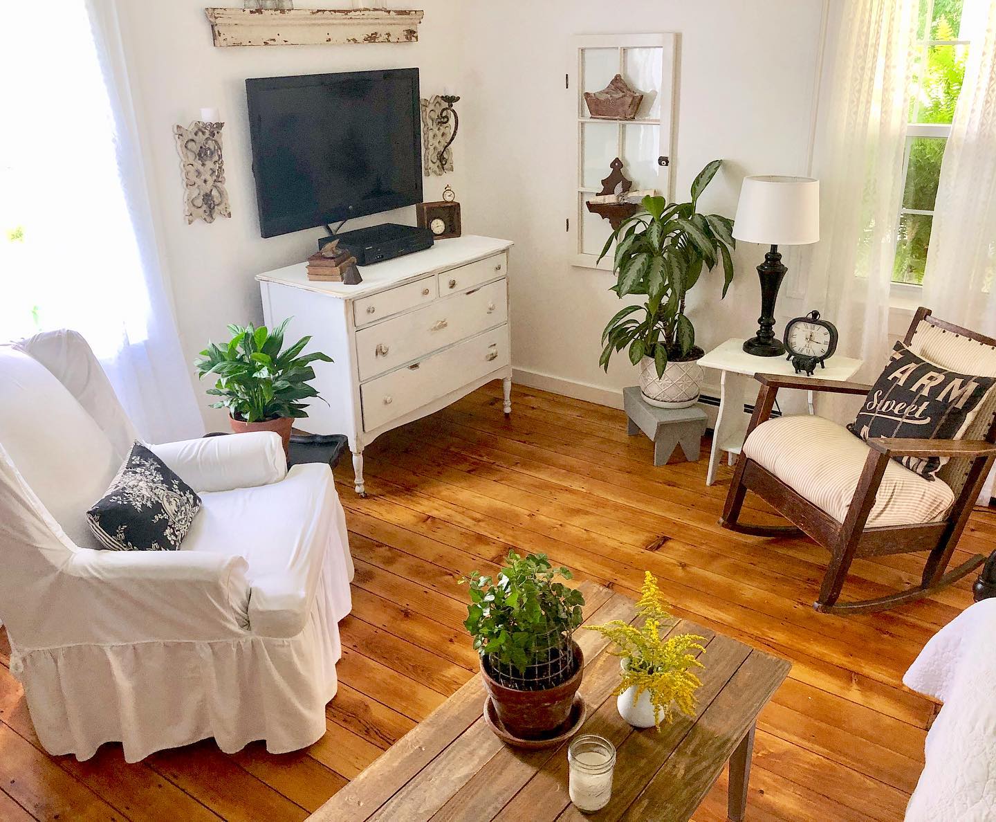 14. a Trio Of Masks and a Single Framed Fern Above the Television
