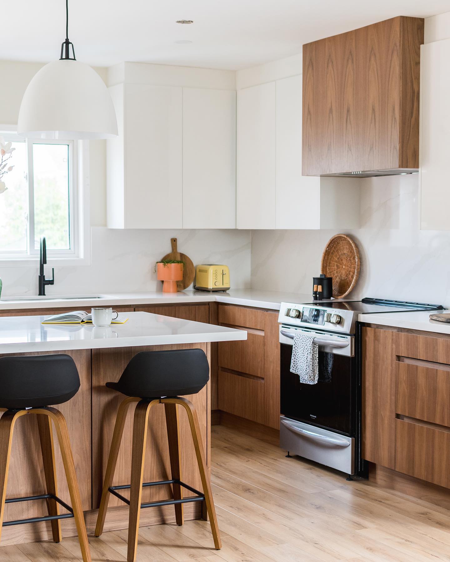 6. Mid Century Kitchen with Atomic Starburst Clock and Retro Red Stools