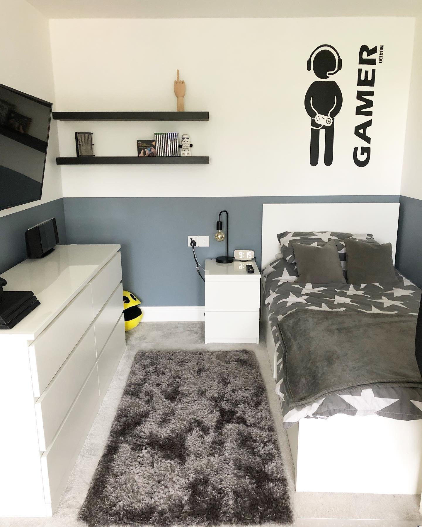 11. Cobalt Blue Accent Wall with Skateboard Shelves and Neon Sign