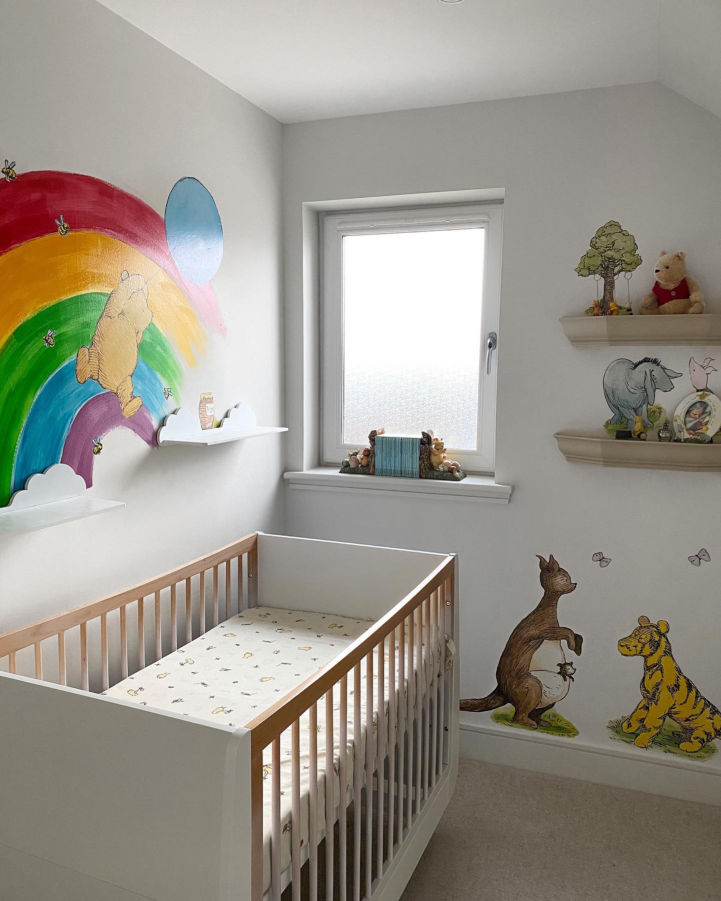 16. a Honeycomb Hexagon Wall Of Pooh Characters Above a Crib