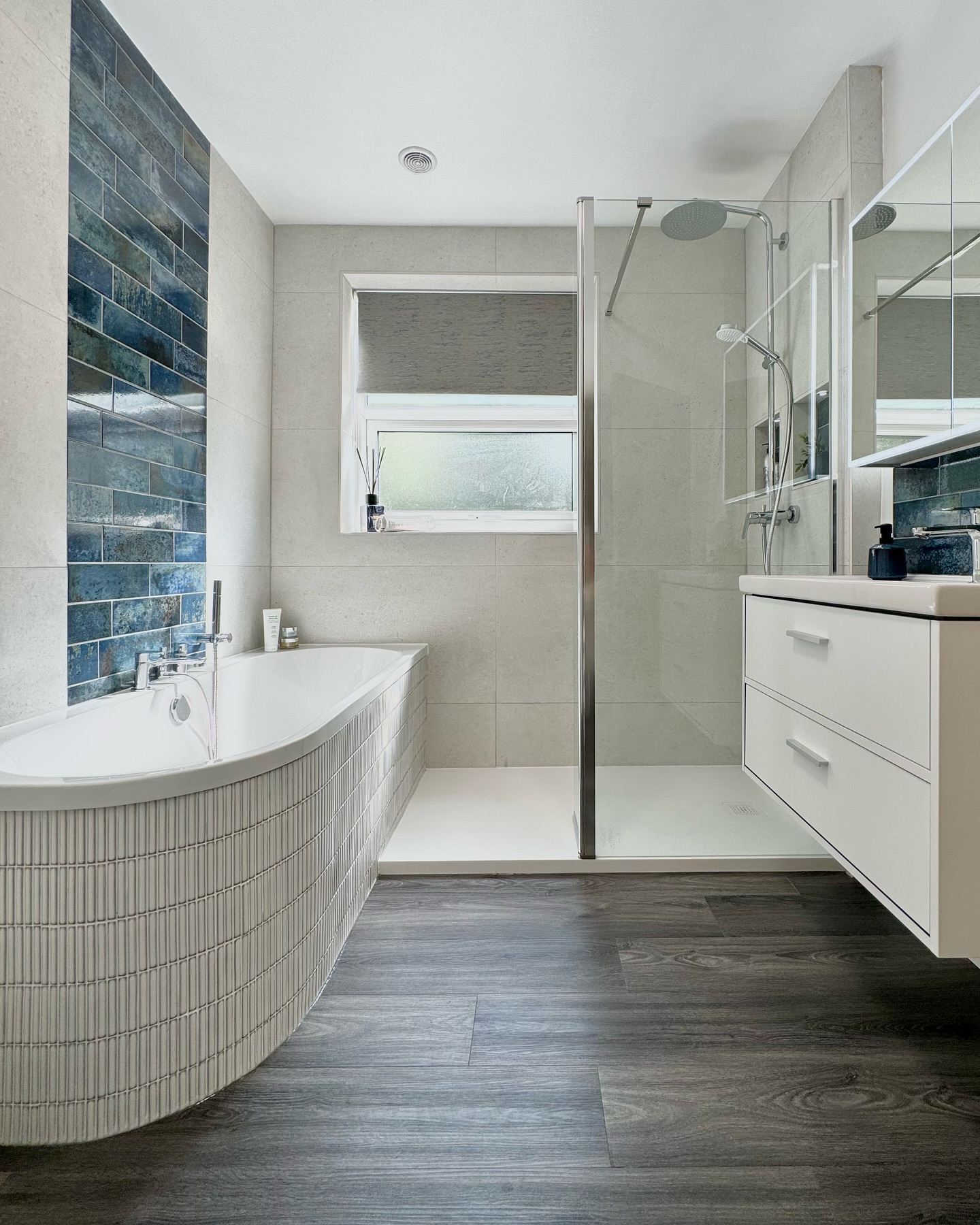 21. Moonlit Marble Mosaic: a Walk-in Shower with a Crescent Moon Inlay