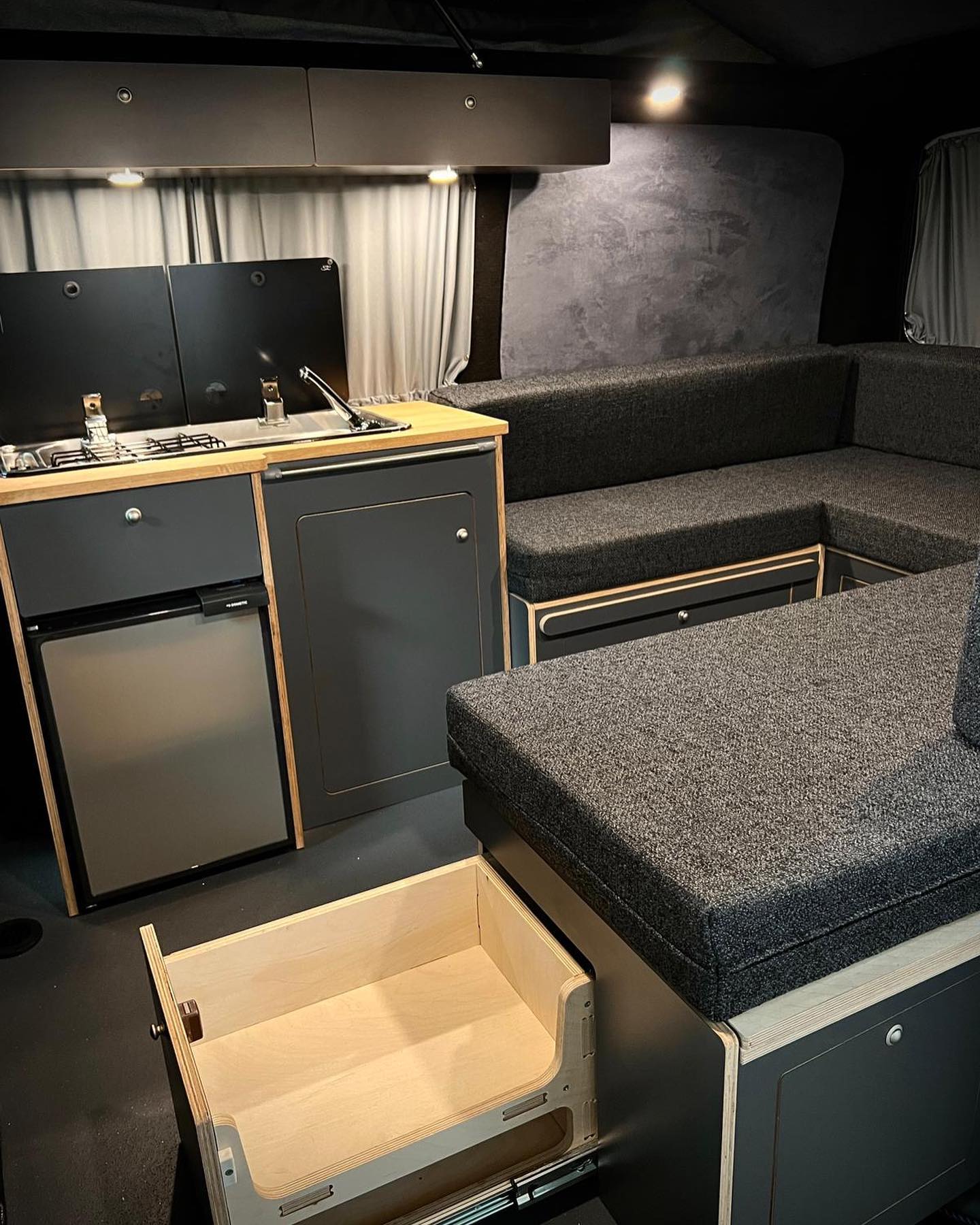 14. a Cozy Nook with a Geometric Quilt and Vintage Lantern Light