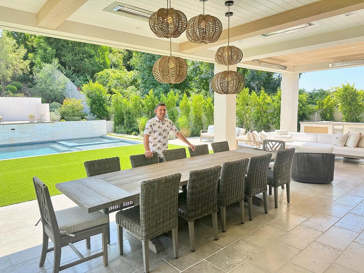 17. Moonlit Moss and Wicker Retreat: a Patio Where Nature Meets Comfort