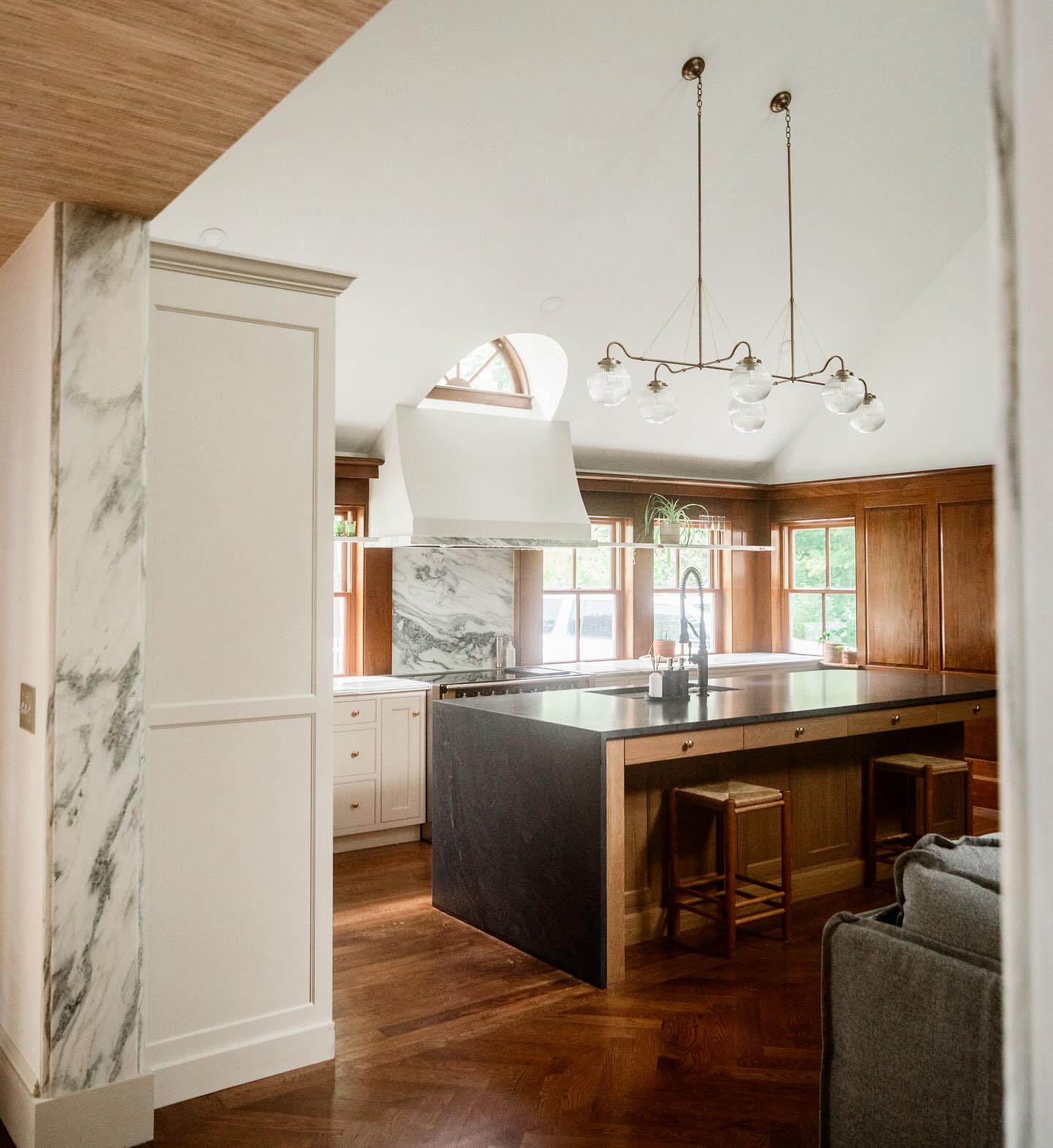 27. Mid Century Maple Cabinets with Geometric Teal Backsplash