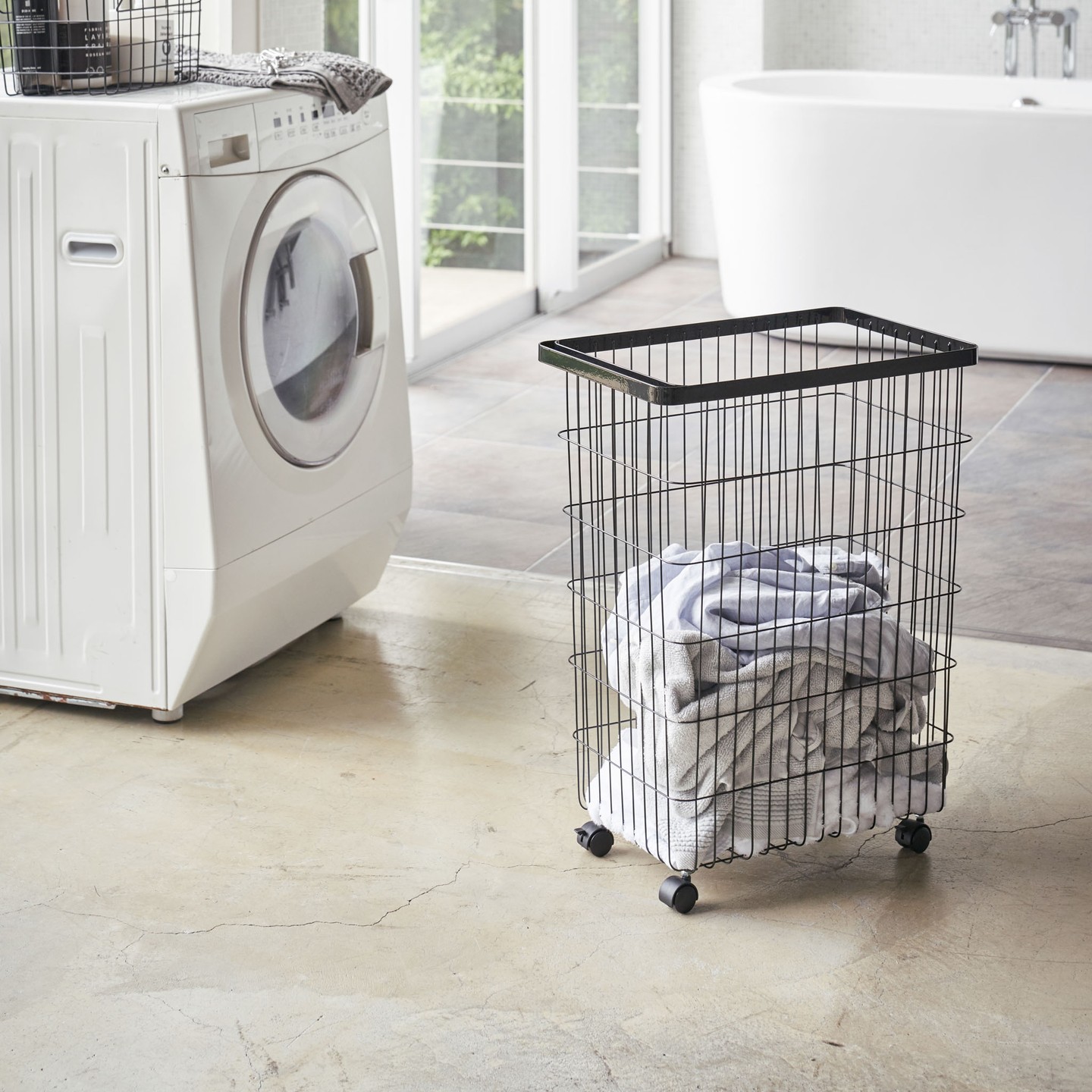 5. Moonlit Marble and Wicker Fusion: a Serene Laundry Solution