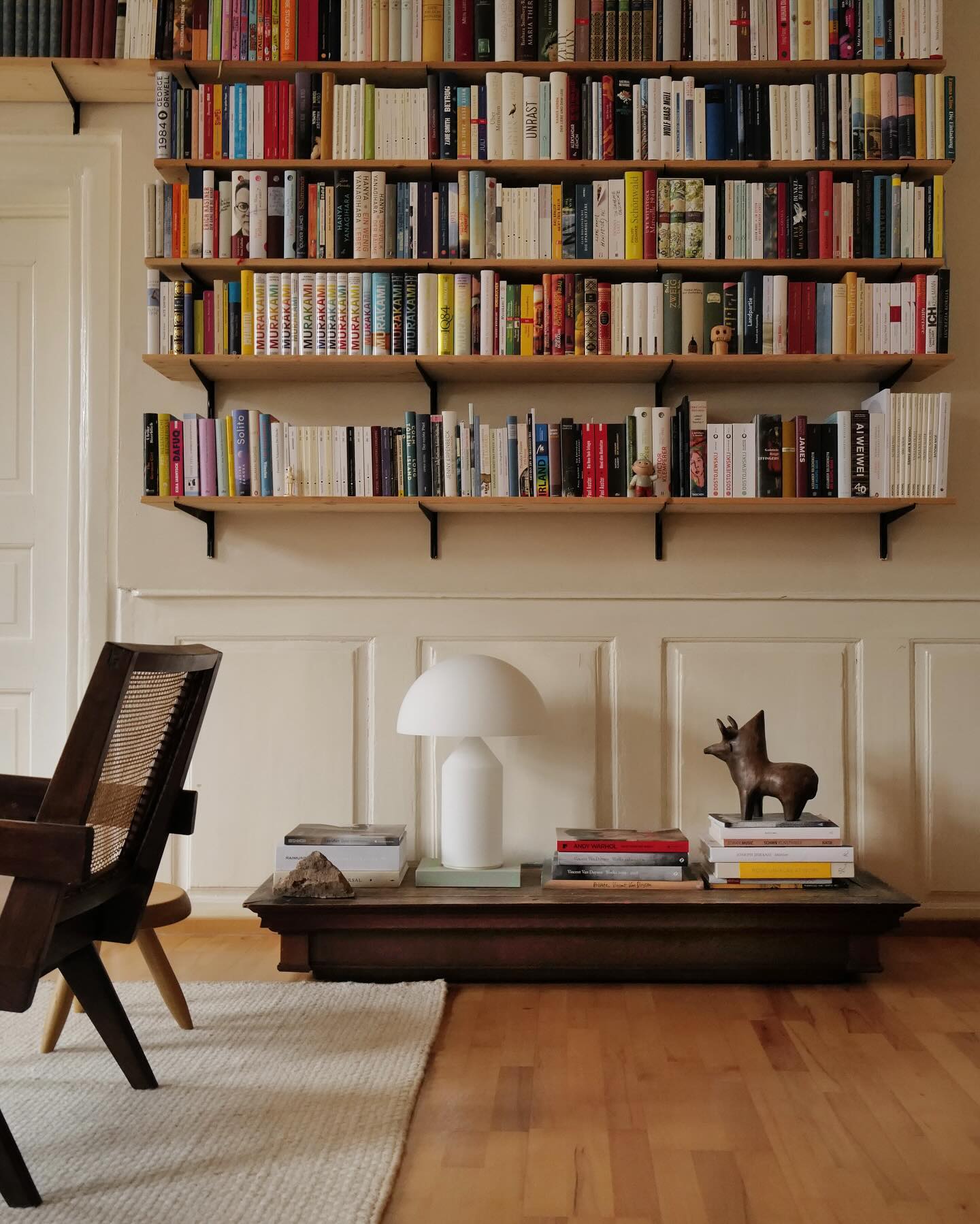 17. Bookshelf Arrangement with Vintage Radio and Geometric Vases