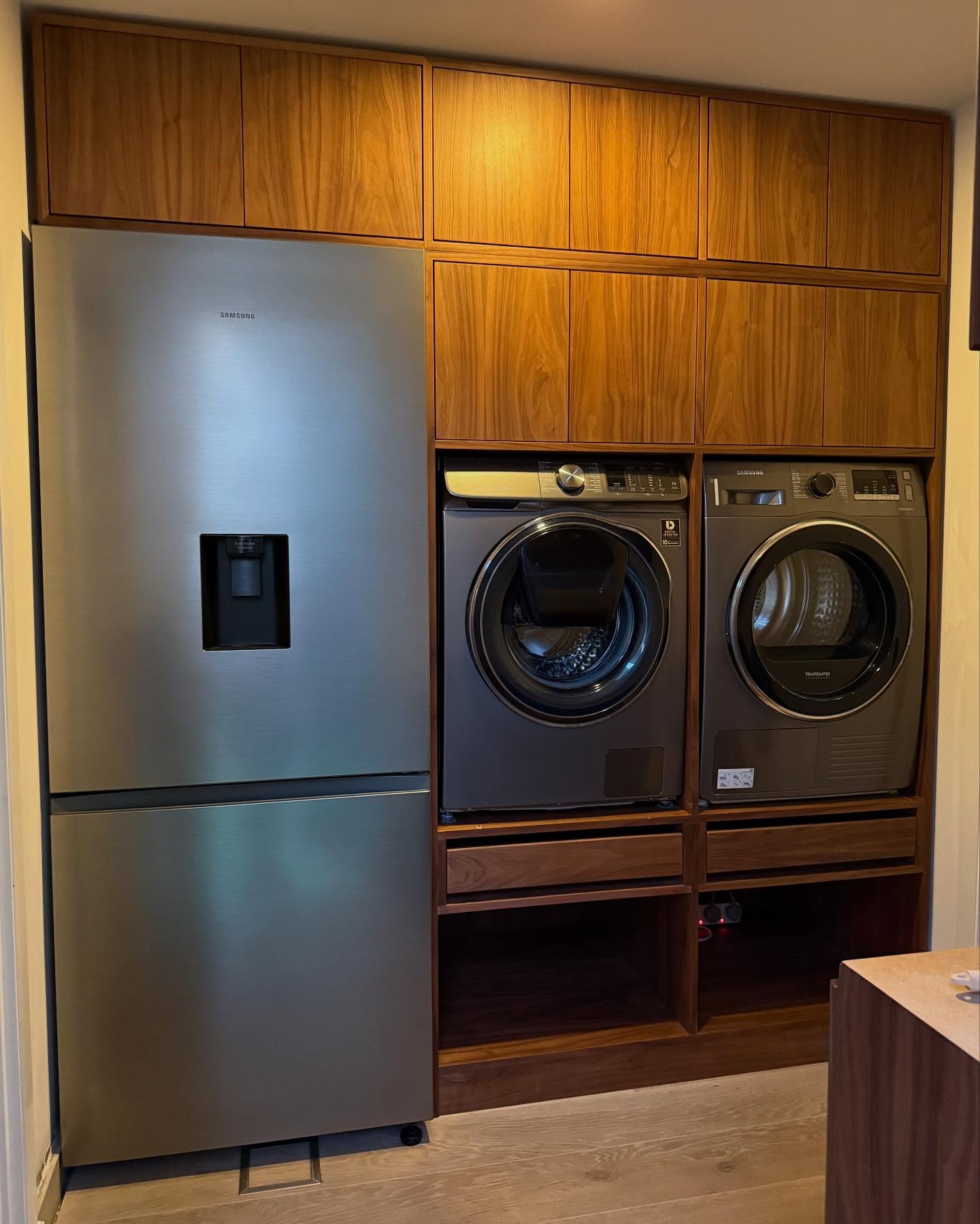 10. a Symphony Of Sliding Doors and Wicker Baskets In a Compact Laundry Space