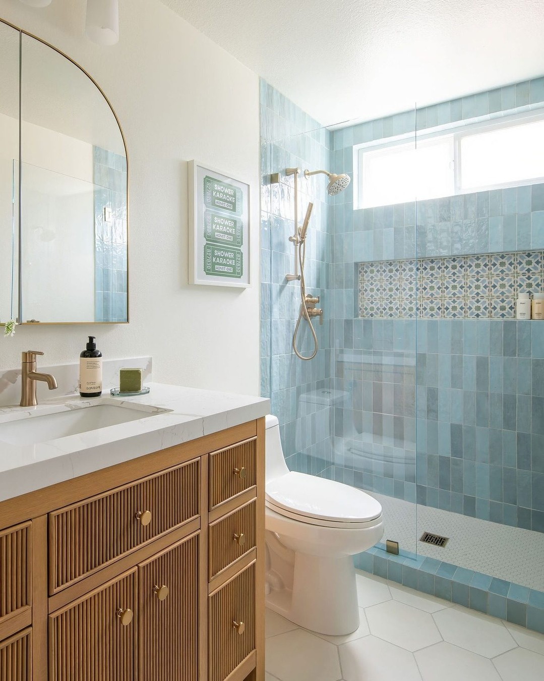 7. the Seashell Mosaic and Wicker Basket Accent Coastal Bathroom