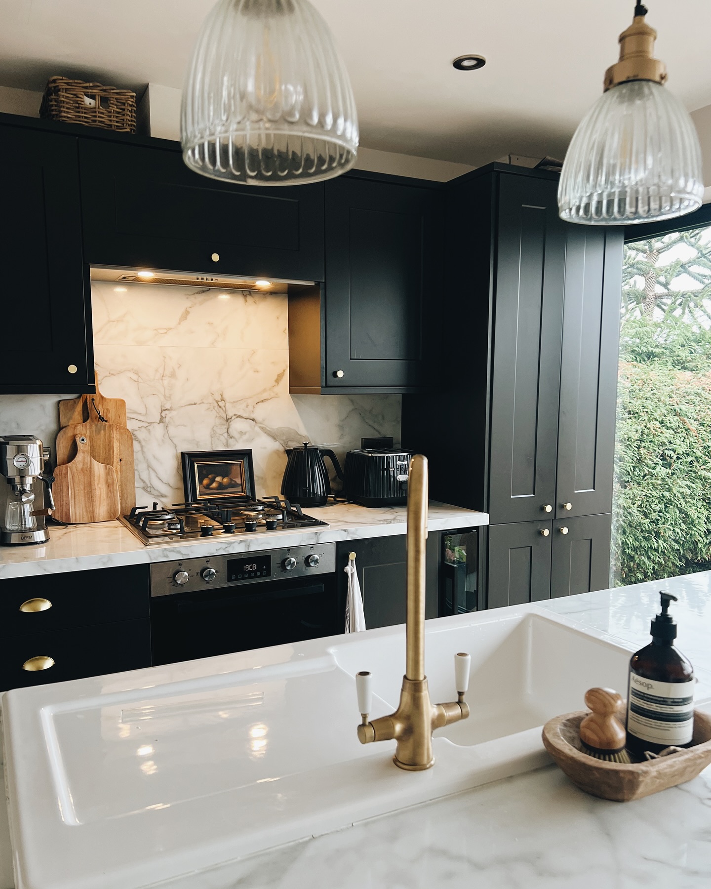 17. the Rustic Charm Of a Weathered Wood Island with Industrial Pendant Lights