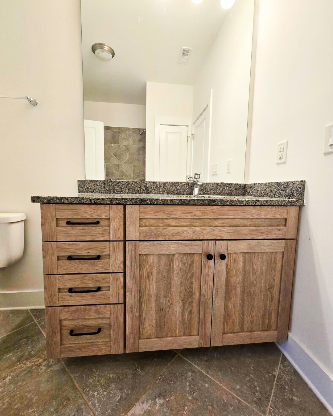 12. Moonlit Marble and Copper Accents: a Bathroom Cabinet with Eclipsing Charm