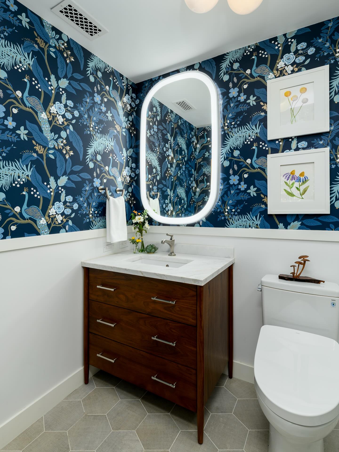 20. Vibrant Teal Sink Against Geometric White Tile Mosaic with Golden Accents
