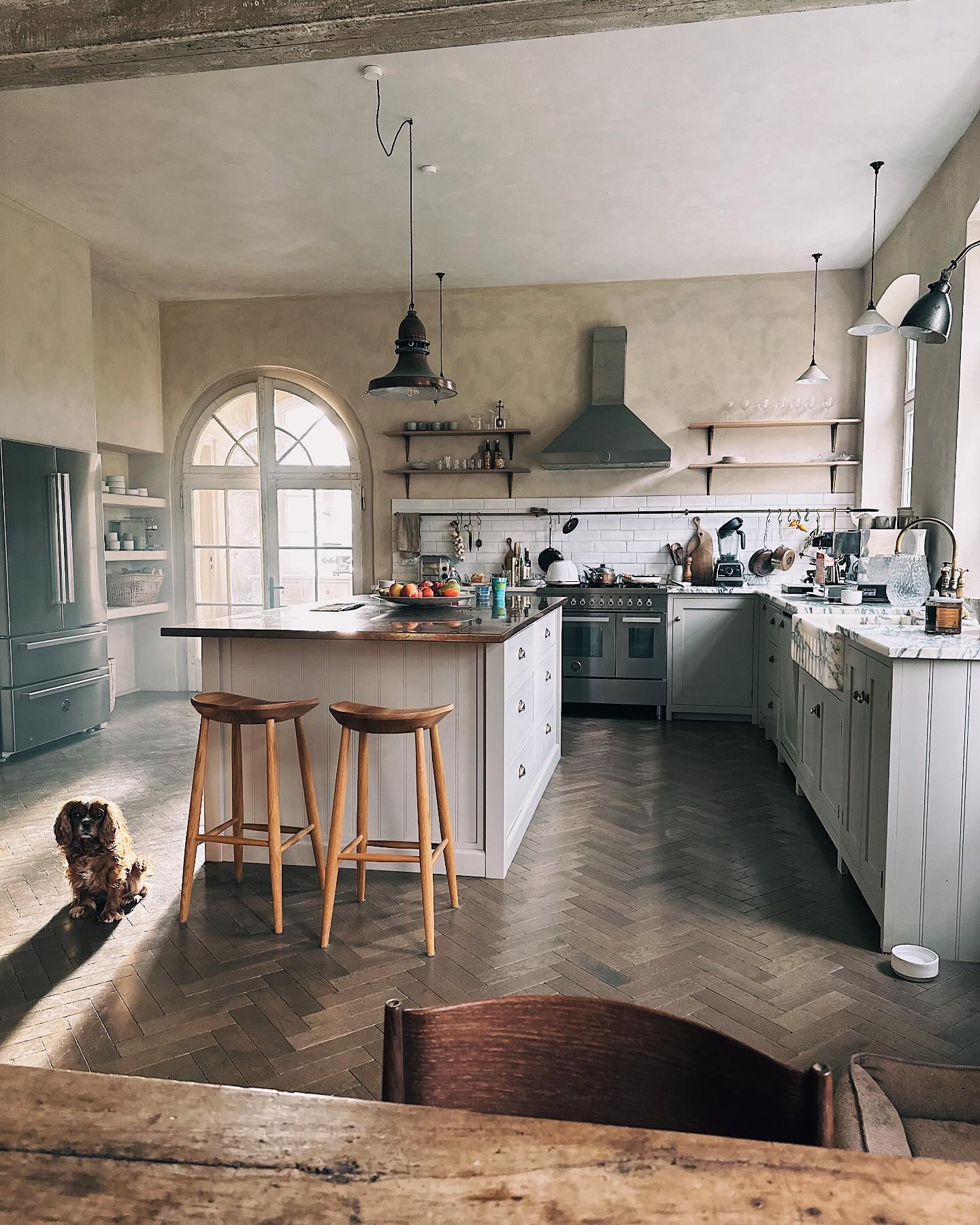 12. Rustic Charm with Hexagonal Backsplash and Antique Blue Hutch