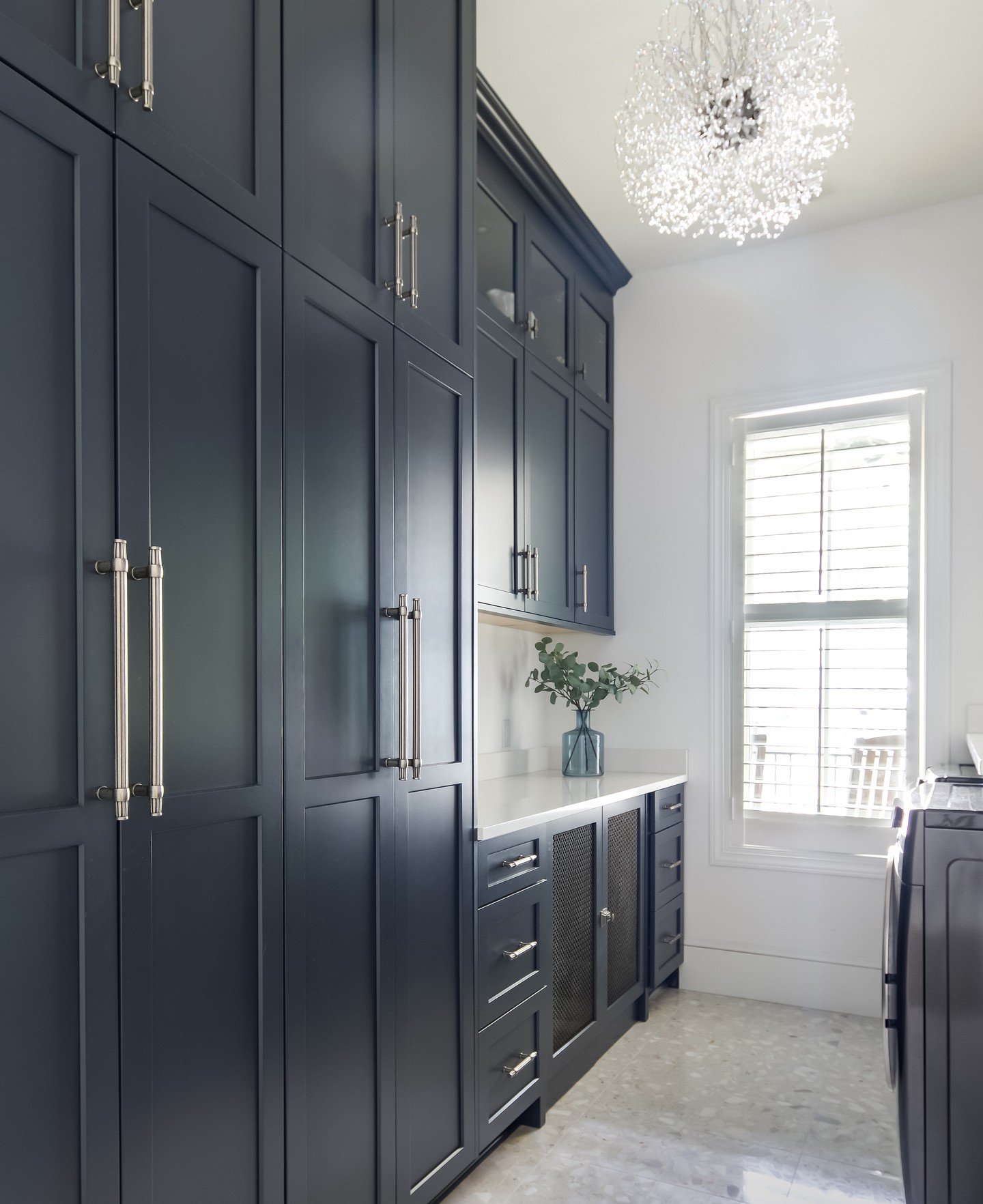 13. a Symphony Of Slatted Doors and Copper Accents In a Compact Laundry Space