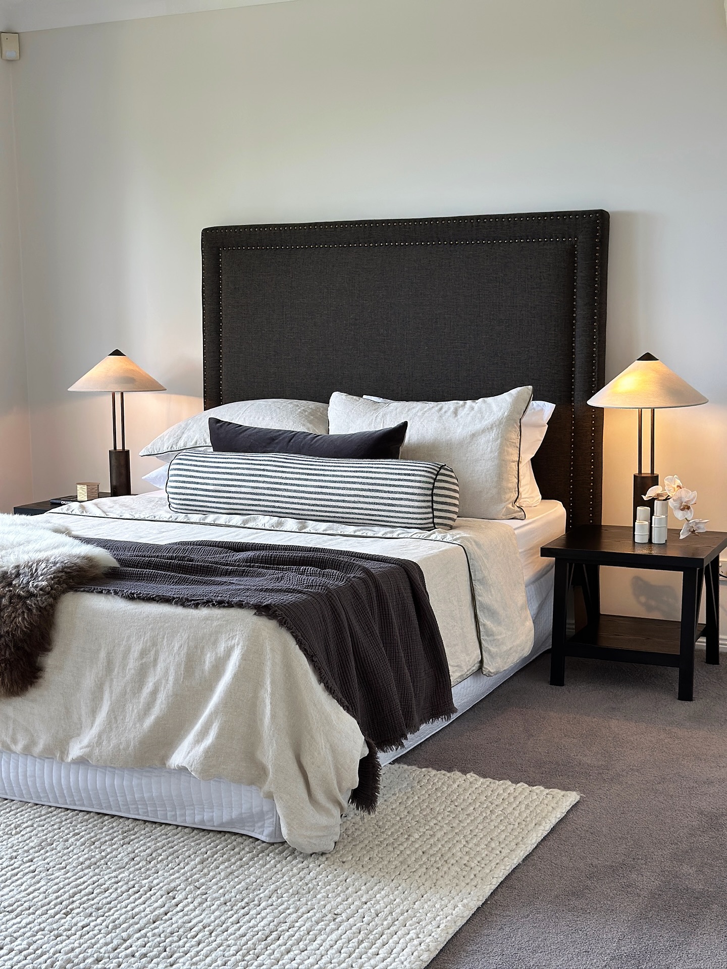 5. a Monochromatic Tapestry Of Shadows and Light with a Geometric Headboard