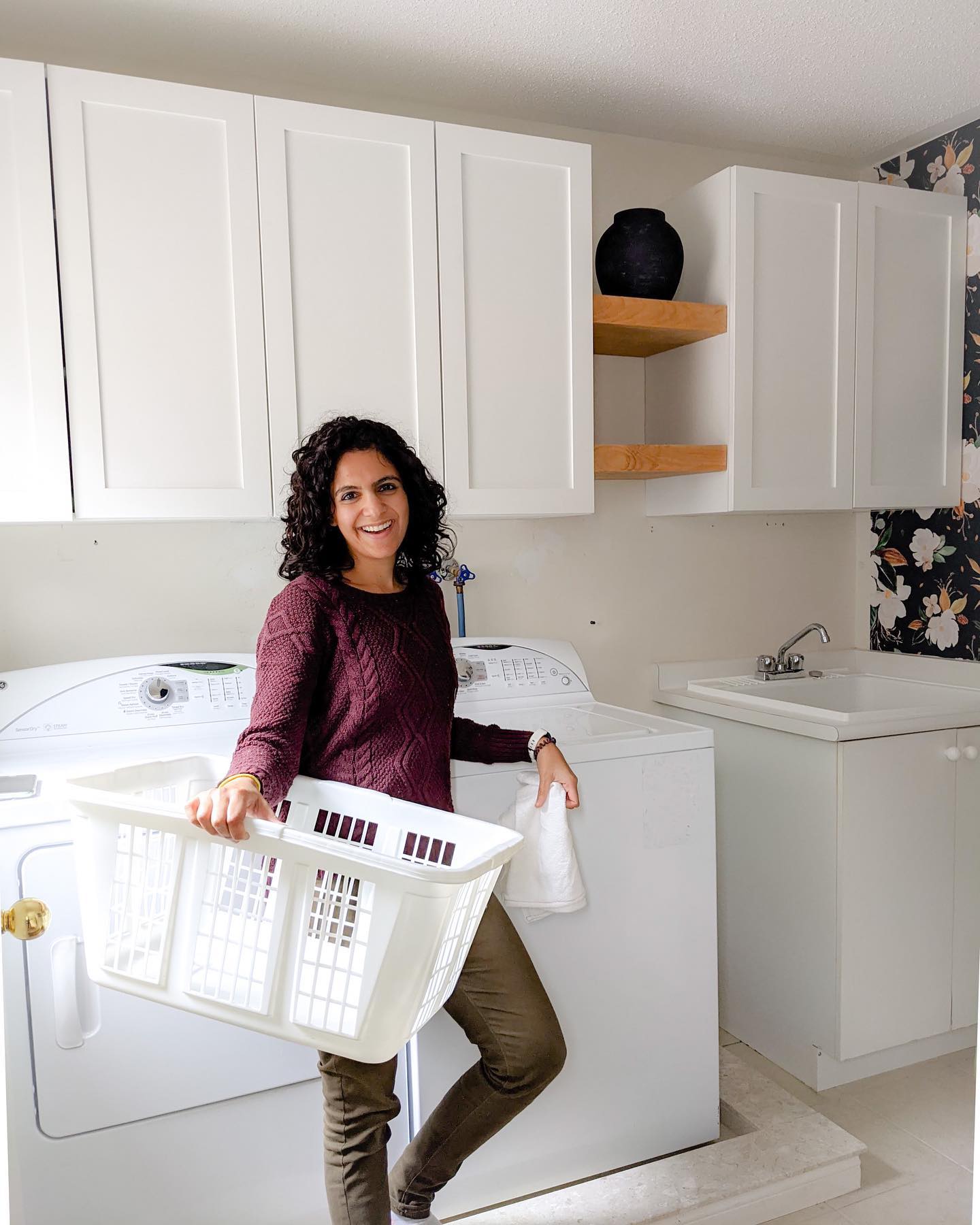 11. the Mosaic Tiled Laundry Room Cabinet with Copper Handles and Built-in Ironing Board