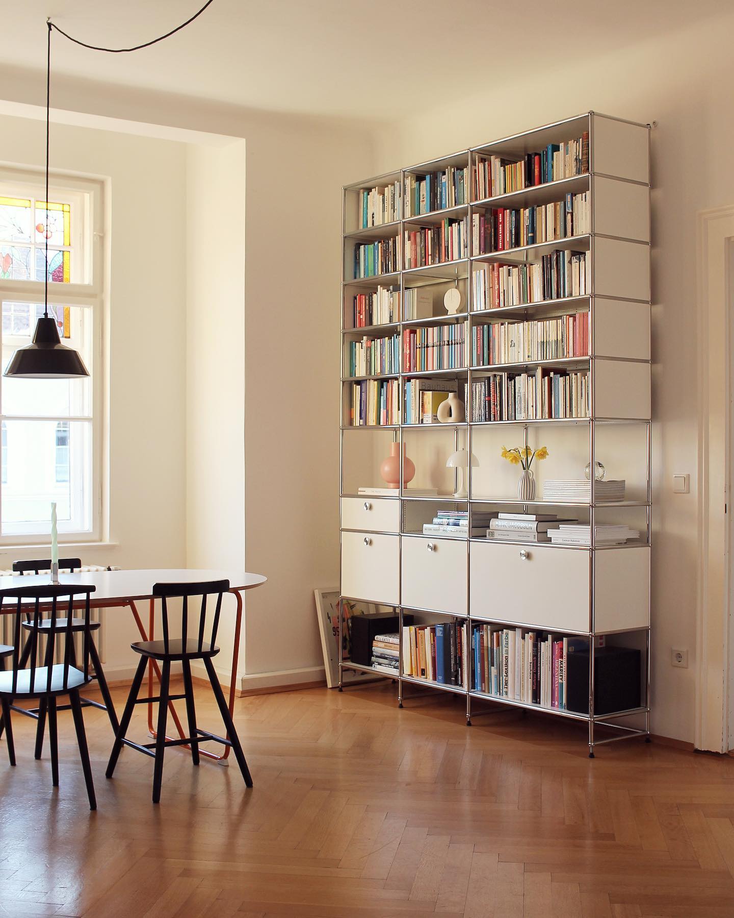 14. Velvet-covered Book Spines and Geometric Shelves: a Living Room's Hidden Art Gallery