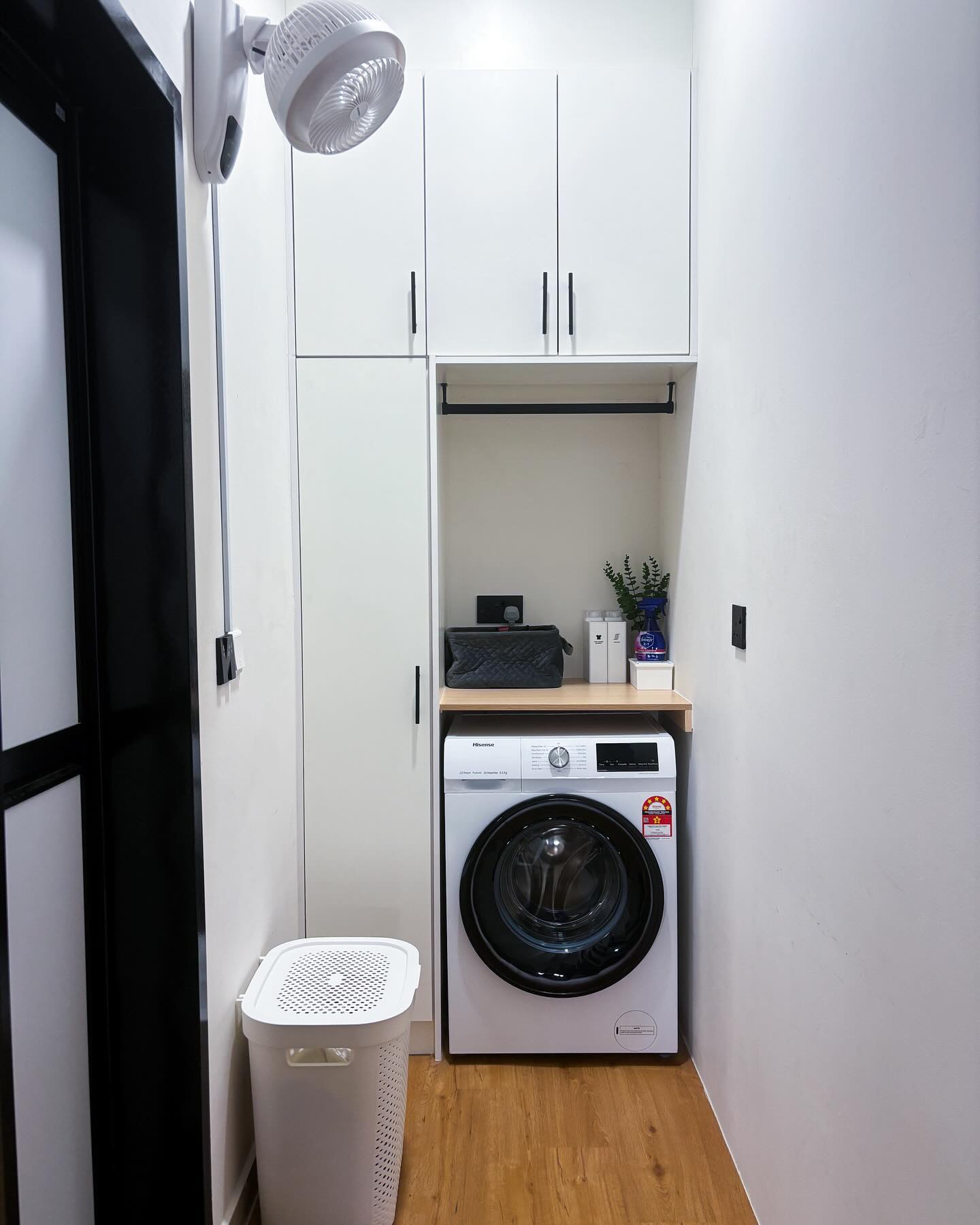 1. Cobalt Blue Accents and Sliding Barn Doors Laundry Room Cabinet