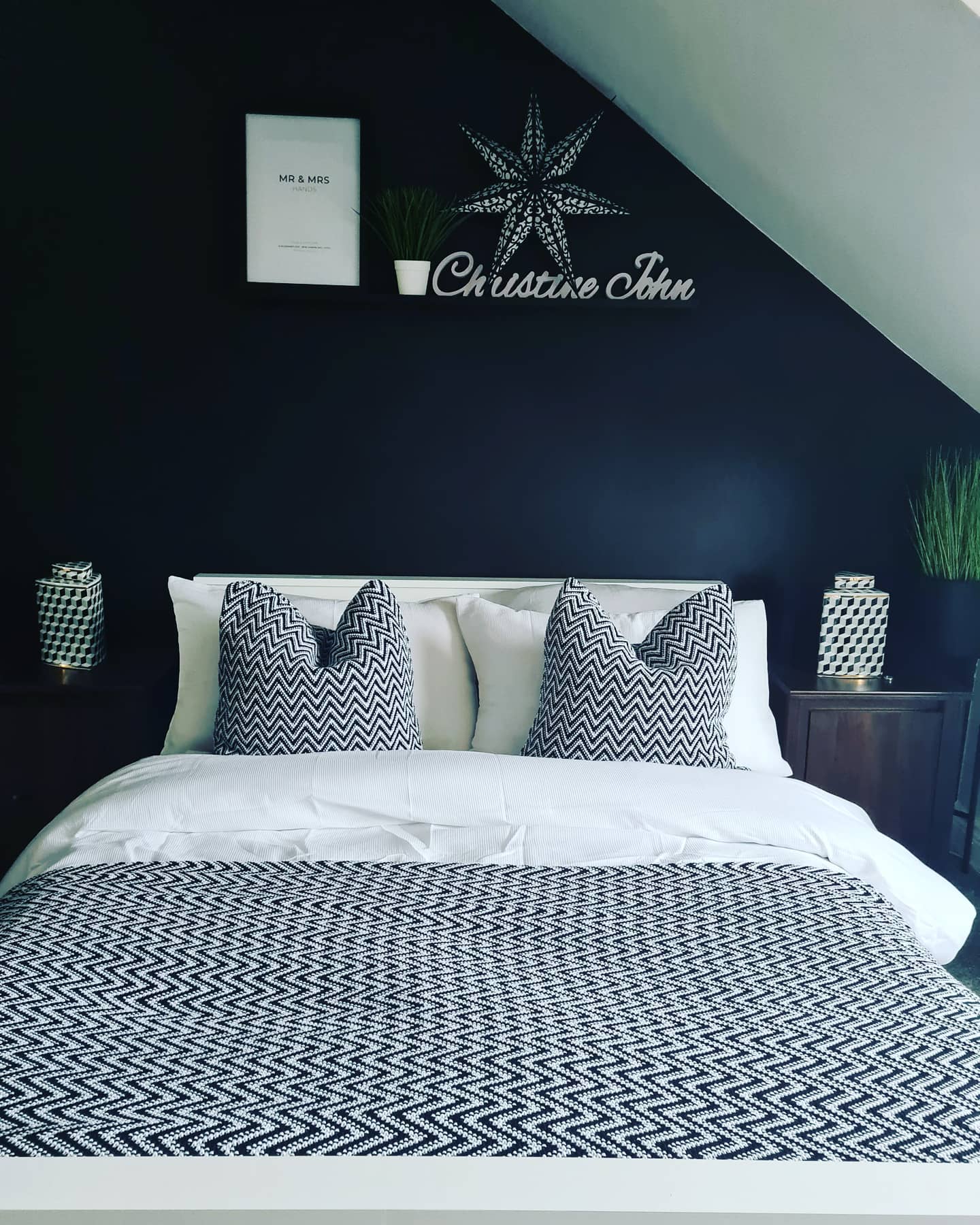 1. Midnight Moonlit Shadows: the Black and White Bedroom with a Crescent Wall Accent
