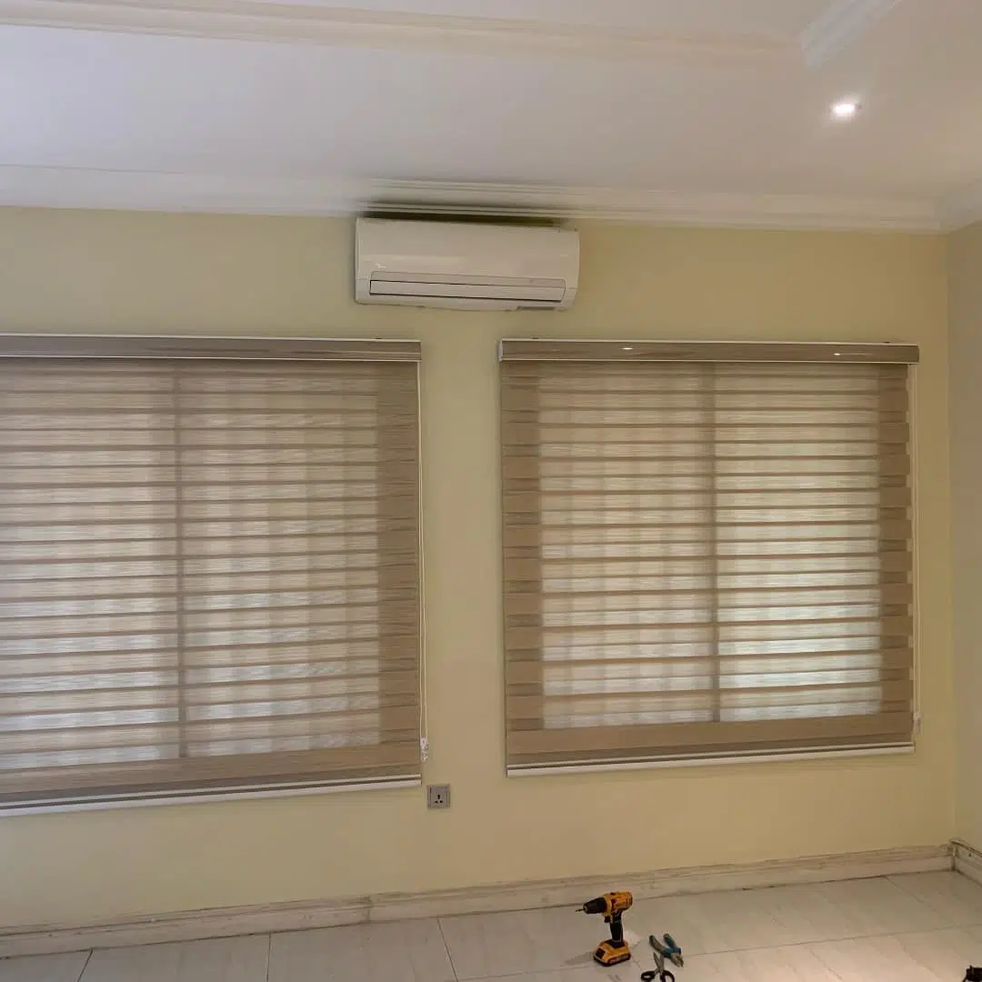 1. the Intricate Dance Of Light and Shadow Through Geometrically Patterned Blinds