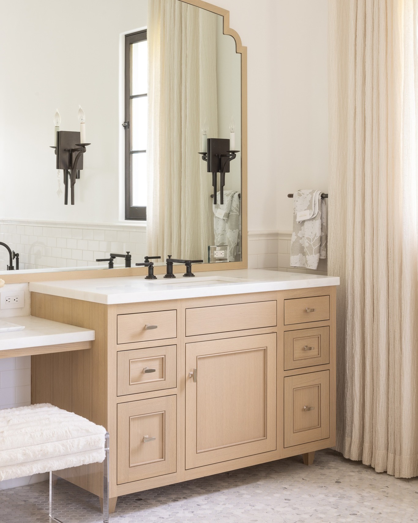 13. Glossy White Panels Meet Geometric Hexagon Tiles In a Compact Bathroom Haven