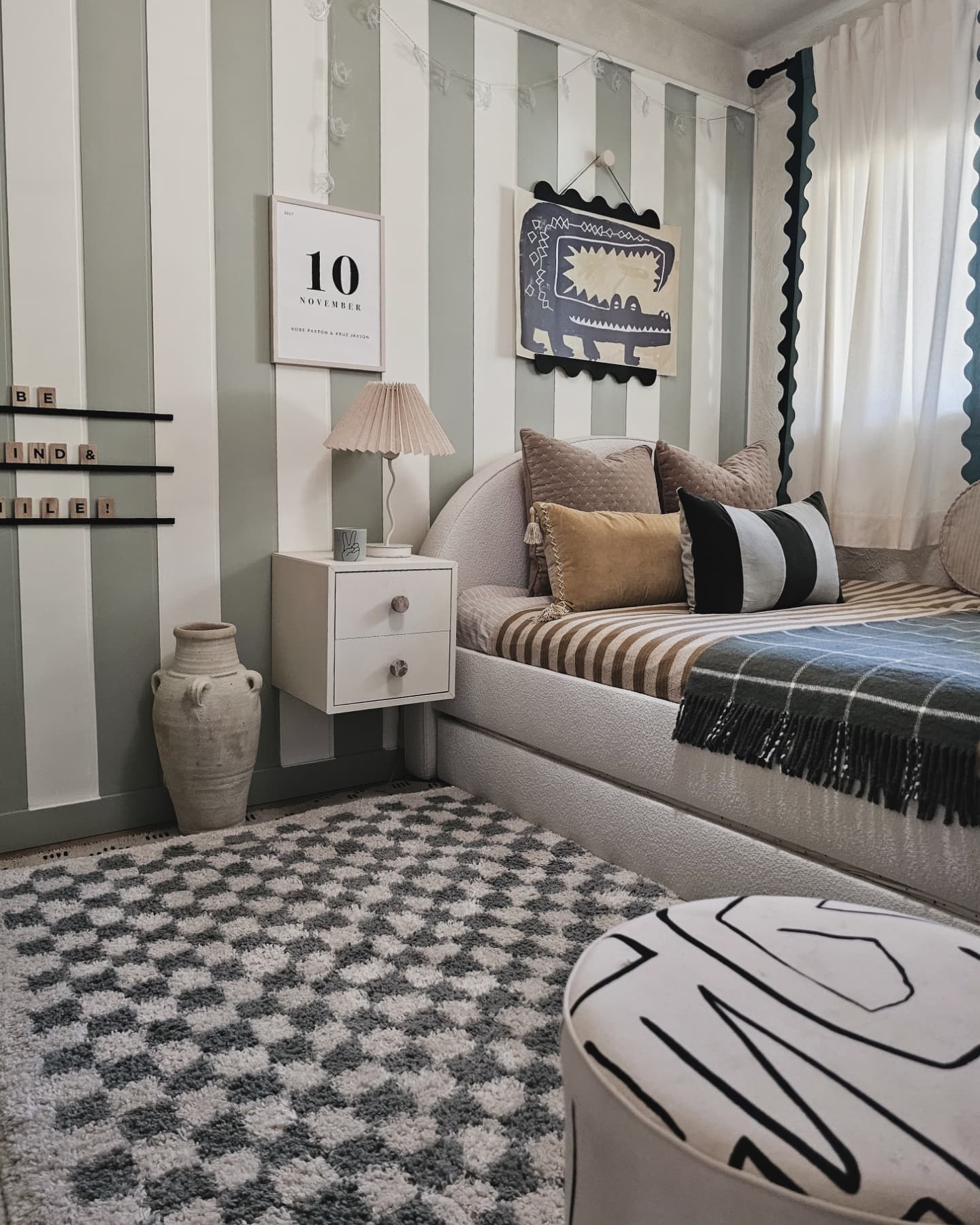 11. Vibrant Rainbow Wall Accent with Cozy Nook Bedding