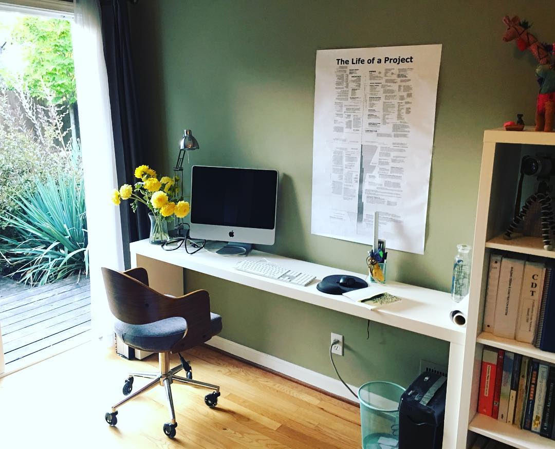 23. Sunlit Nook with a Retro Twist: a Vintage Typewriter and Modern Monitor Fusion