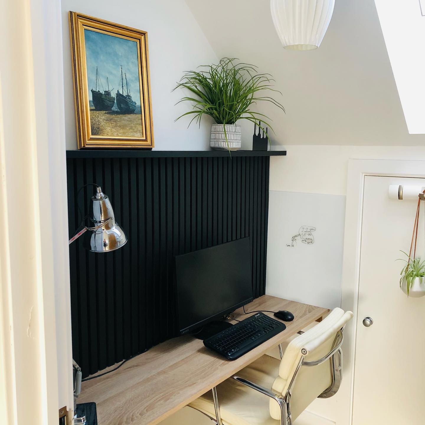 25. Cobalt Blue Accent Wall with Geometric Shelving and Vintage Desk