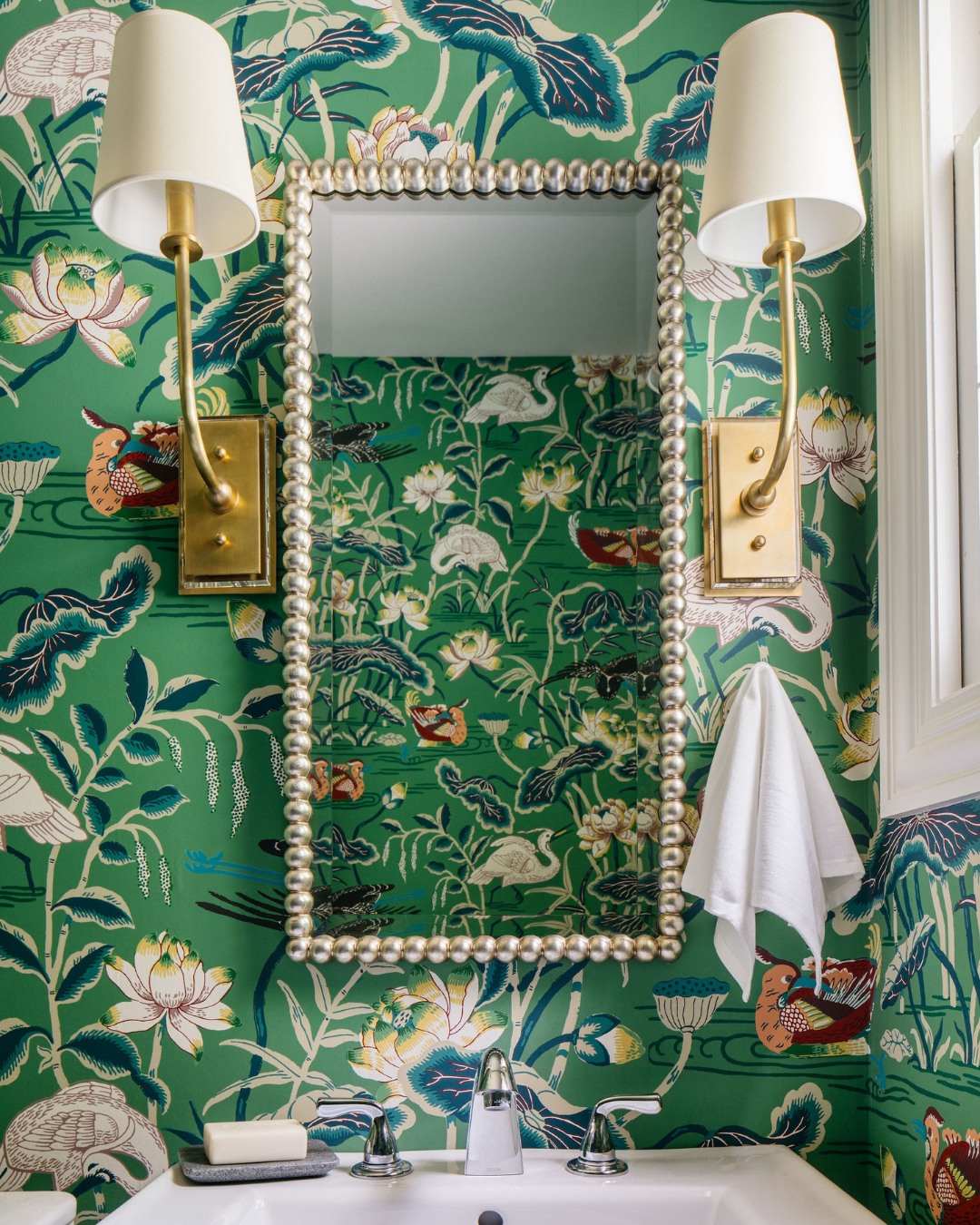 10. Vibrant Fuchsia Tiles Meet Chrome Elegance In Compact Sanctuary