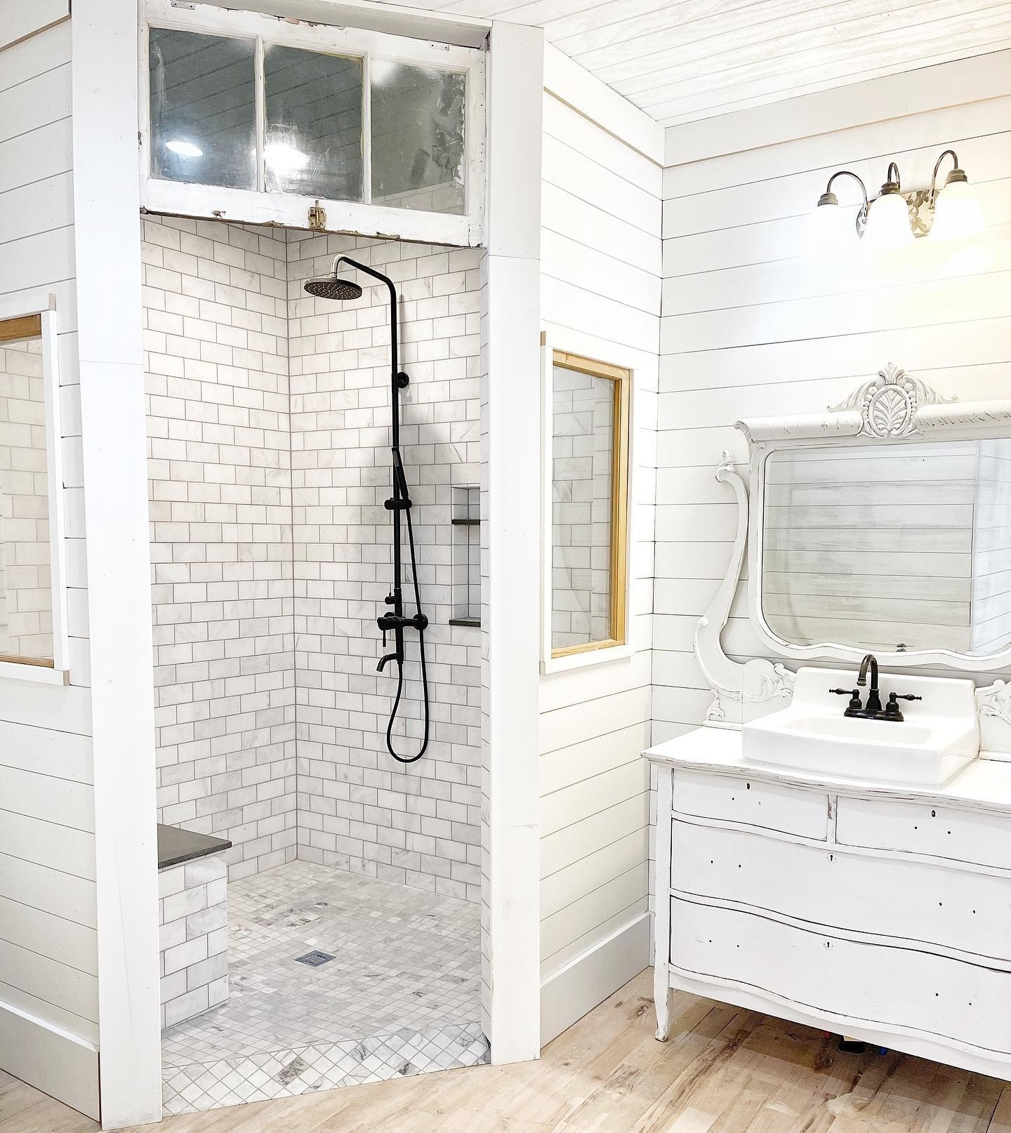 13. Rustic Charm with Repurposed Ladder Towel Rack and Industrial Piping Fixtures