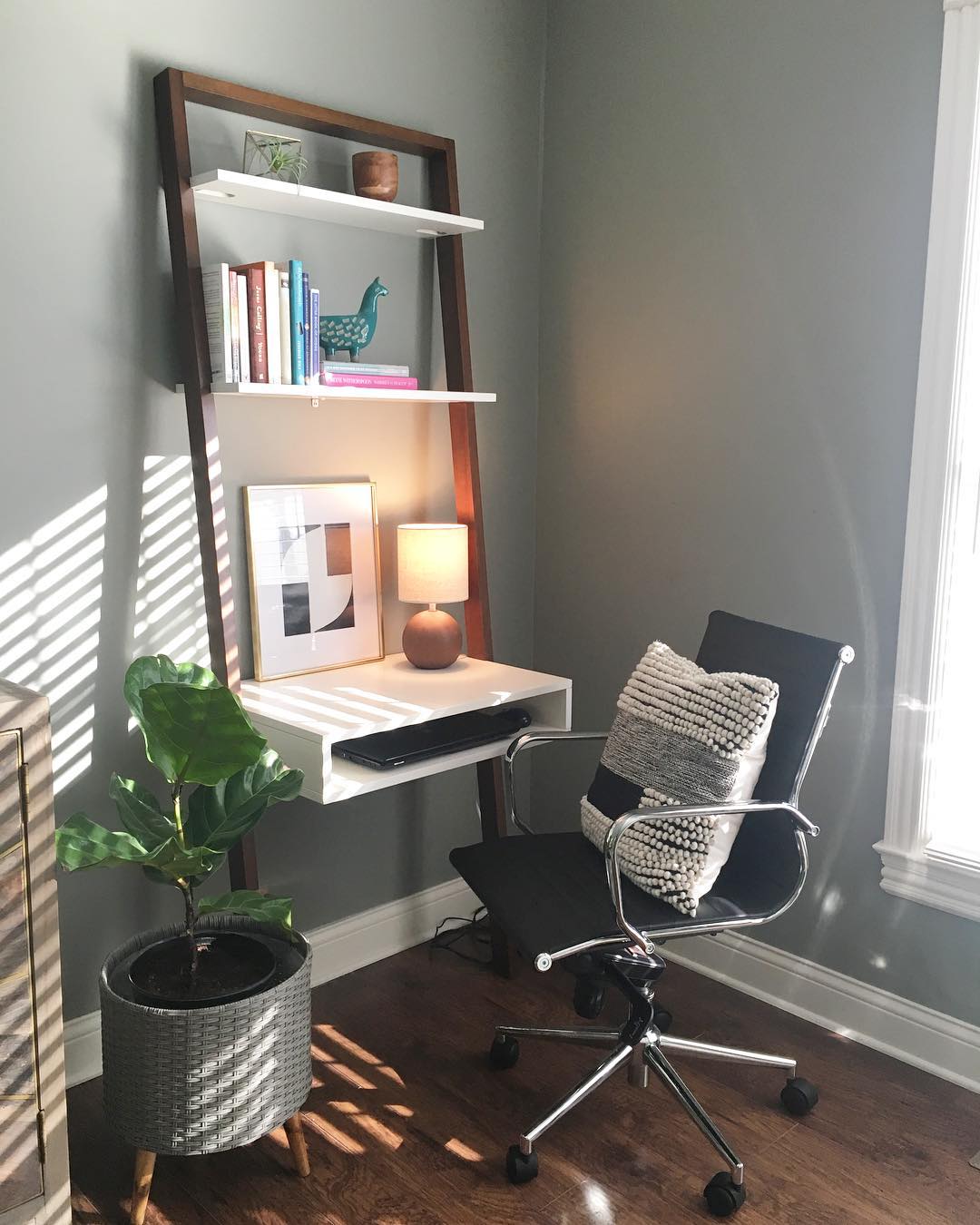 2. a Bamboo Ladder Shelf and Rattan Chair Nook In a Corner Office