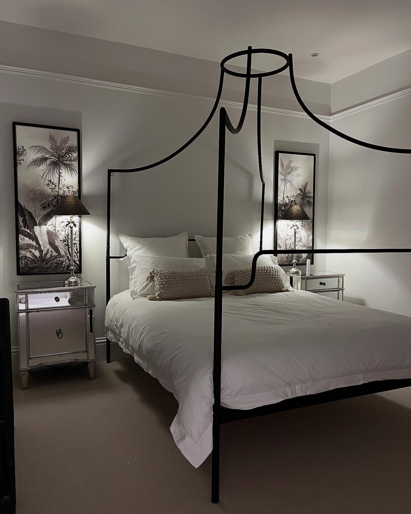 4. Moonlit Serenity: Black and White Bedroom with Floating Bed and Geometric Wall Art