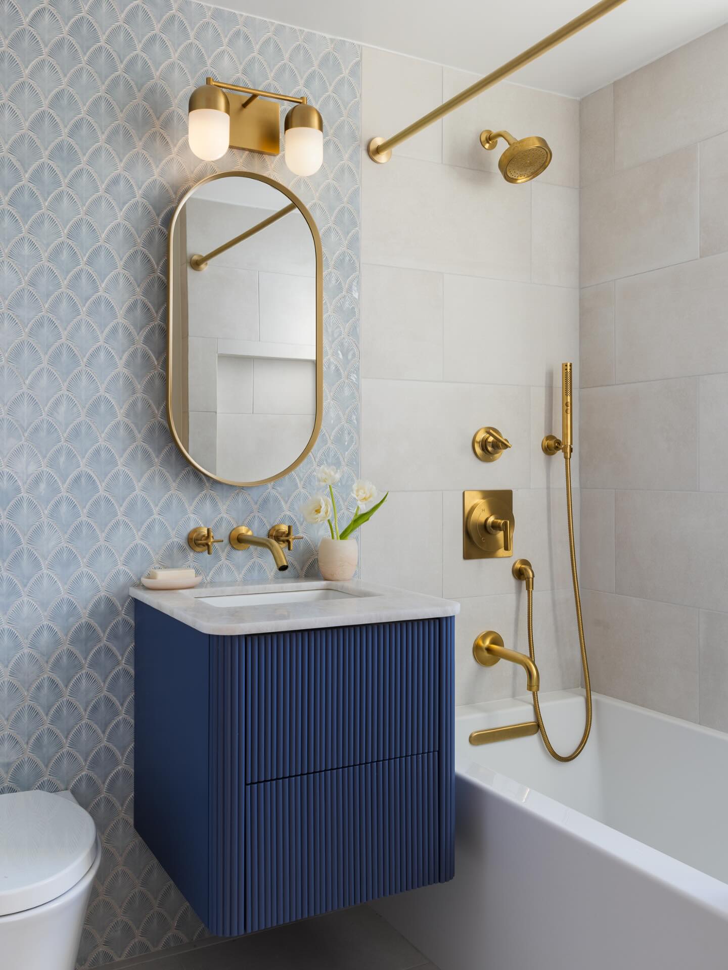 23. Vibrant Teal Accents Against Crisp White Tiles with a Vintage Mirror