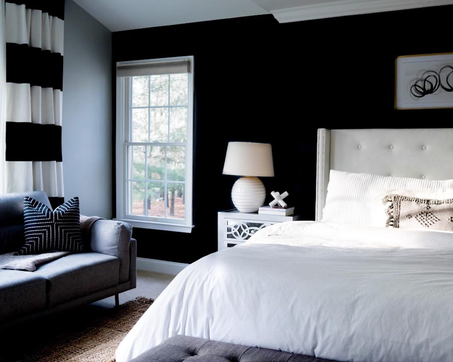 19. Moonlit Minimalism: a Canopy Bed with Geometric Wall Accents
