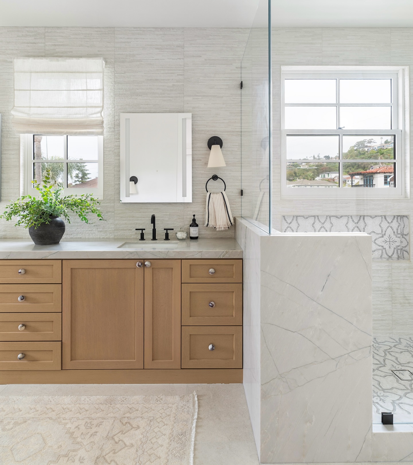 12. Coastal Breeze Meets Industrial Chic: Exposed Bulb Lighting Over Freestanding Tub