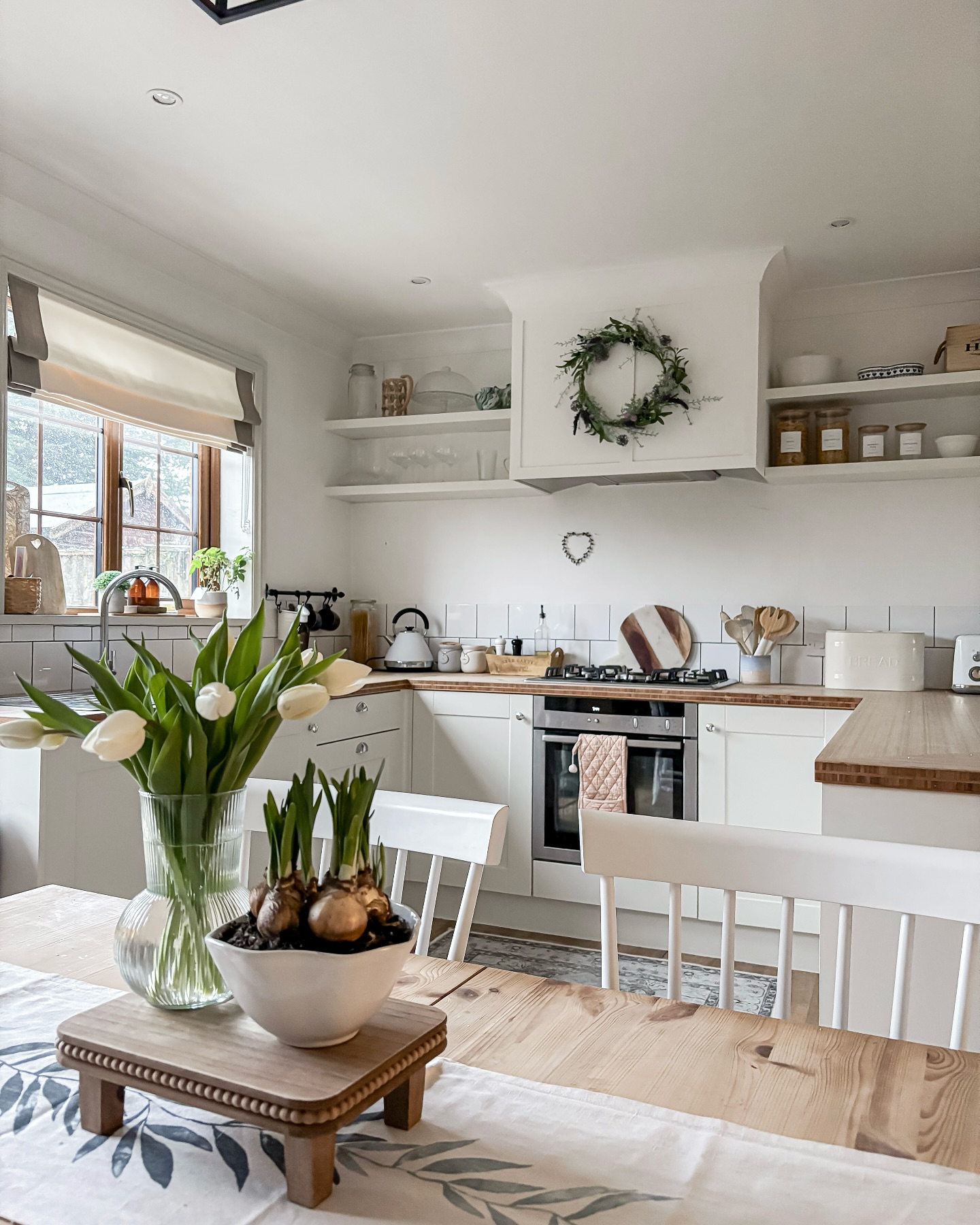 8. Vintage Milk Canisters and Sunlit Herbs: a Rustic Kitchen Nook