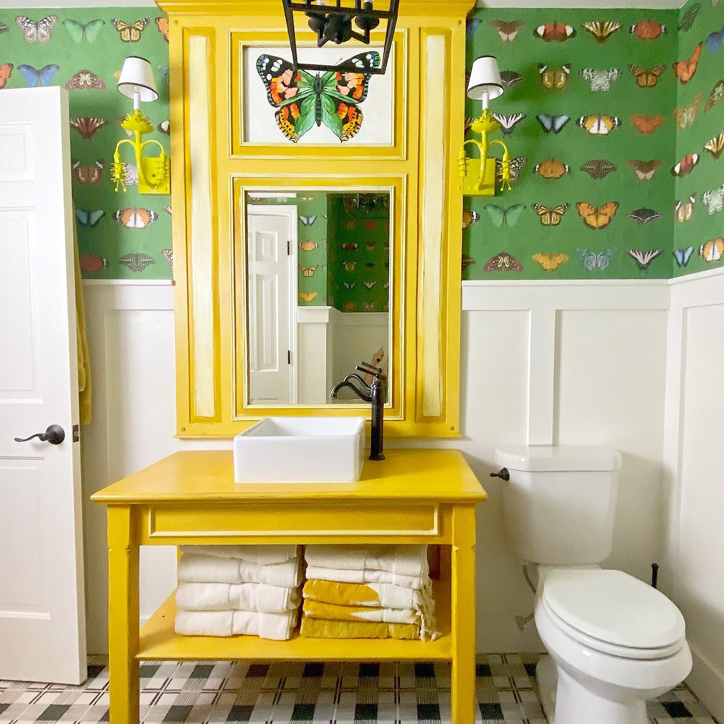 13. Vibrant Mosaic Tiles and Retro Sink Fusion In a Compact Space